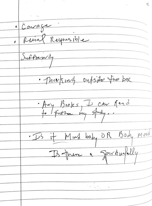 A notebook page with text reading 