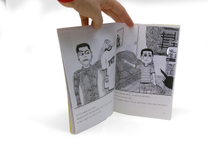 Another detail of the previous zine. This photograph shows two pages of its interior, with indistinct text and drawings featured.
